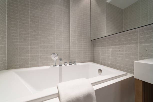 istock Compact white cozy bathroom with bathtub, White bathroom clean and comfortable. 1406329579