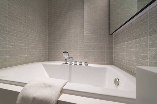 istock Compact white cozy bathroom with bathtub, White bathroom clean and comfortable. 1406329586