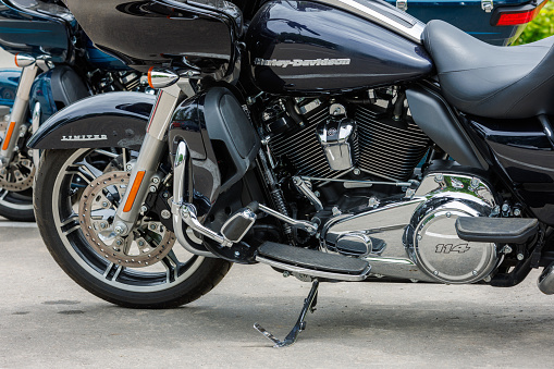 2022 Harley-Davidson Road Glide Limited Motorcycle on asphalt parking at spring day - close side view on engine and front wheel in Tula, Russia - June 5, 2022