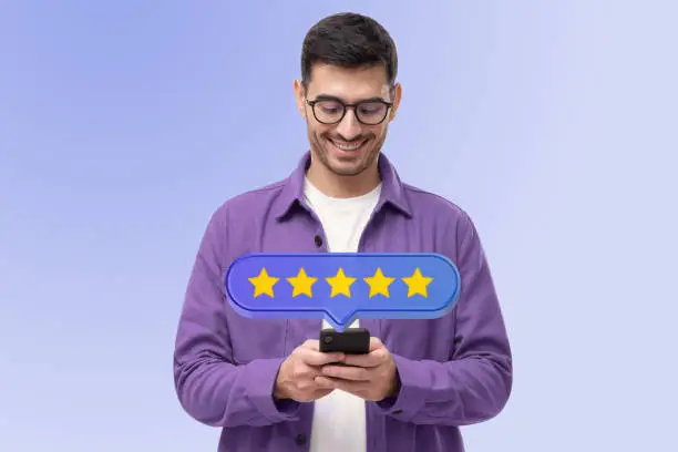 Photo of Five star rating icon and customer giving excellent feedback via phone app