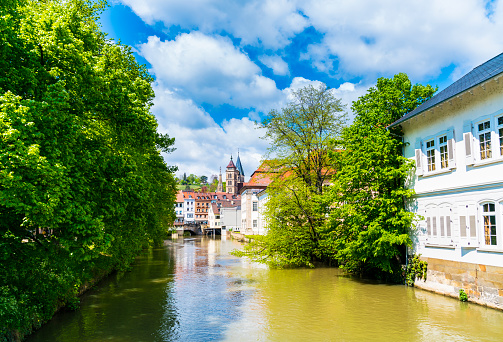 Germany, Old town houses of esslingen am neckar city in summer with blue sky and sun next to neckar river water, a tourism destination famous and popular