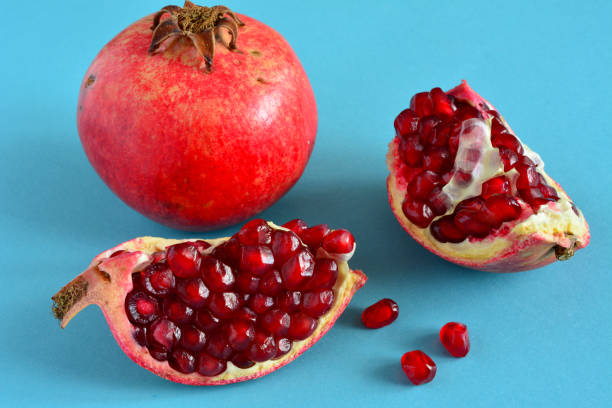 istock pomegranate fruit with red seeds isolated, close-up 1406334760