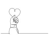 istock Love. Hand holding heart. Continuous line. 1406335704