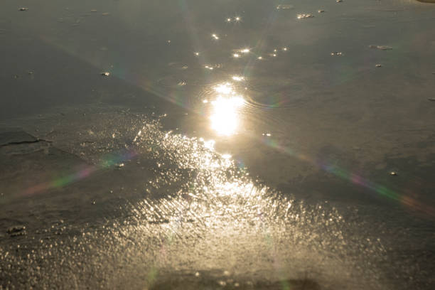 Sun is setting on blue sea.