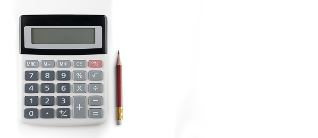 Calculator with pencil on white background. Business report concept. wide banner, copy space. Close up of calculator and red pencil
