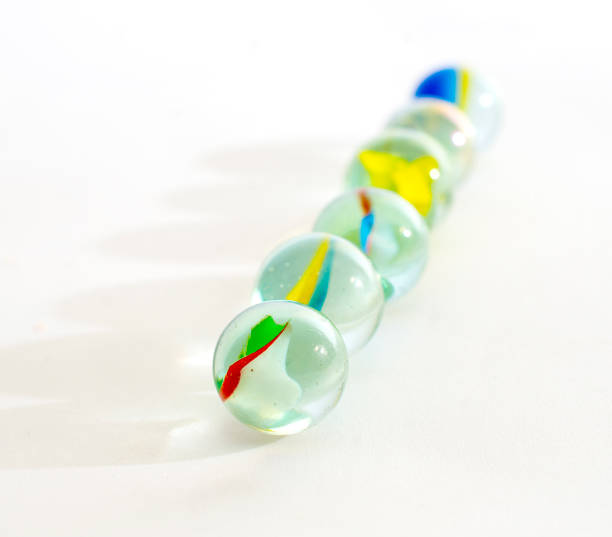 istock Glass marble studio close up shot on white 1406341614