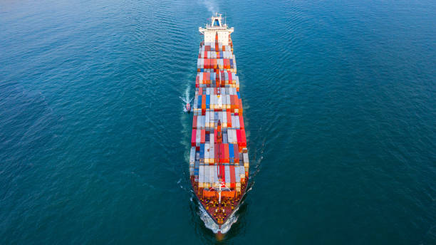 istock Container ship carrying container for business freight shipping import and export, Aerial view container ship arriving in commercial port. 1406341822