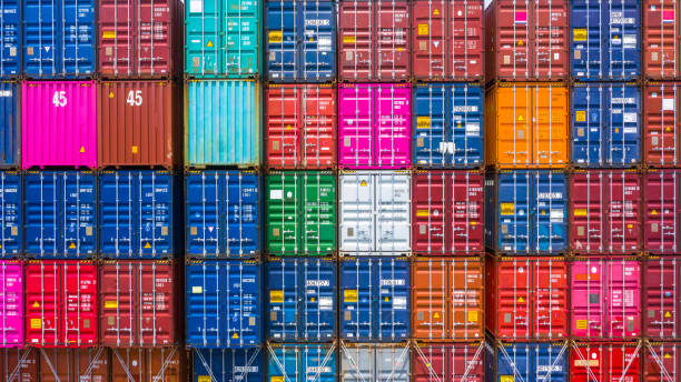 istock Freight shipping containers at the docks, Stack of containers in a container ship at deep sea port. 1406342900