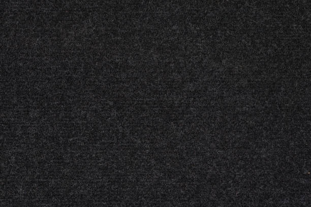 黒い合成車のカーペットの質感とフルフレームマクロの背景 - felt textured textured effect textile ストックフォトと画像
