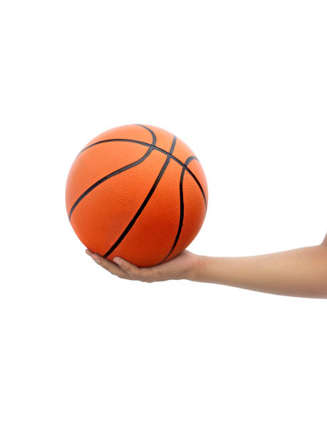 istock Hand and basketball isolated on white background 1406344540
