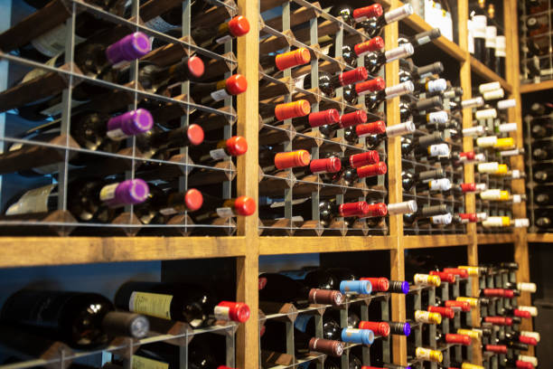 istock Wine bottles on a large wine rack 1406345500