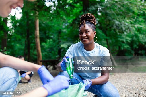 istock A multiethnic group of people, cleaning together in a public park, are protecting the environment. The concept of recycling and cleaning 1406345622