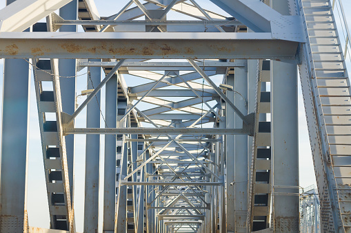 Steel supports of a road bridge across the river.
