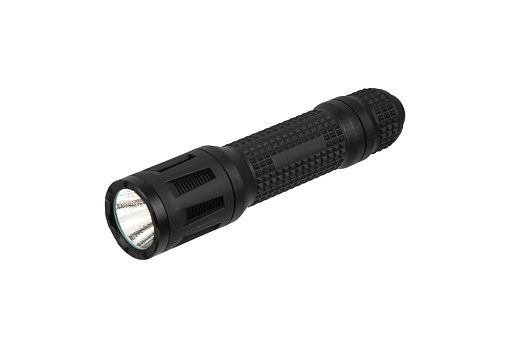 Black metal LED flashlight isolate on a white background. Pocket lamp for dark time of day or dark rooms.