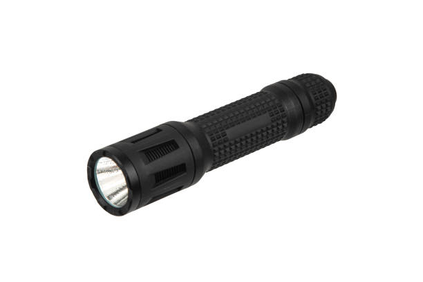 Black metal LED flashlight isolate on a white background. Pocket lamp for dark time of day or dark rooms. Black metal LED flashlight isolate on a white background. Pocket lamp for dark time of day or dark rooms. flashlight stock pictures, royalty-free photos & images