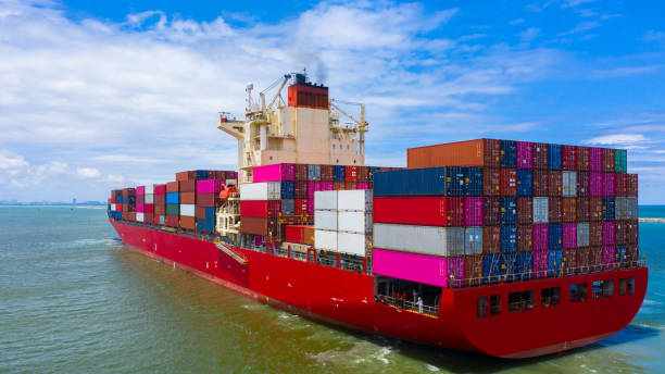 istock Container ship carrying container for business freight import and export, Aerial view container ship arriving in commercial port. 1406350337