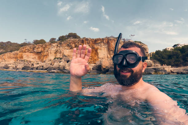 istock Man snorkelling in the sea 1406351177