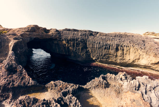 Rock cave on the sea in Cala s'Almunia Mallorca, Spain