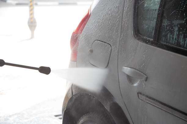 istock A process of flushing soap sud on silver car with pressurised water stream at self-service indoor car wash station 1406351418