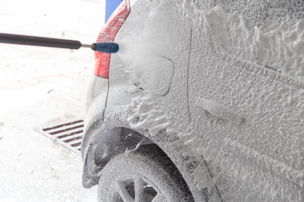 istock soap detergent foam application process while washing indoors at self-service carwash station 1406351454