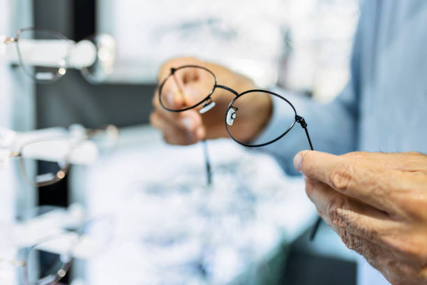 istock Unrecognizable senior man holding eyeglasses 1406351484