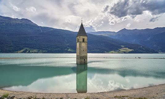 Chiesa di Santa Caterina d'Alessandria's bell tower submerged in Lago di Resia.  The church nave was demolished in 1950 when the artificial lake was created. Reschensee in German and Lago din Resia in Italian.
 Bolzano Province, Trentino Alto-Adige