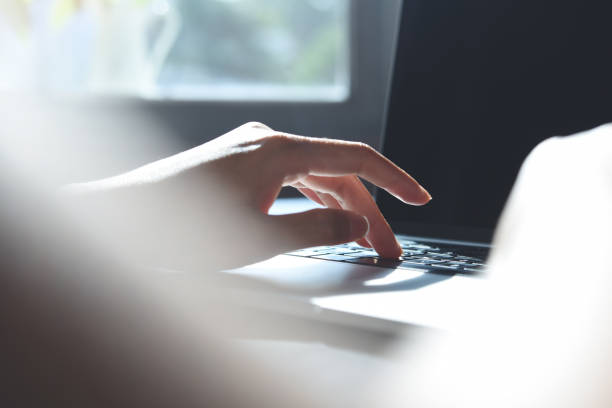 istock Business woman's hands working and typing on laptop computer keyboard on office table, close up 1406352454