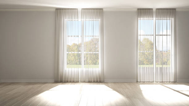 istock Stylish empty room with panoramic windows, parquet wooden floor, classic shutters, white curtains. White background with copy space, interior design concept. Green meadow landscape 1406352745