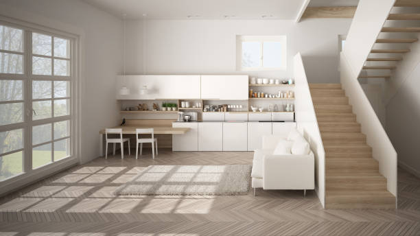 minimalistyczna nowoczesna biała i drewniana kuchnia we współczesnej otwartej przestrzeni z czystymi schodami, salon z sofą i dywanem, pomysł na koncepcję architektury wnętrz - loft apartment window indoors domestic room zdjęcia i obrazy z banku zdjęć