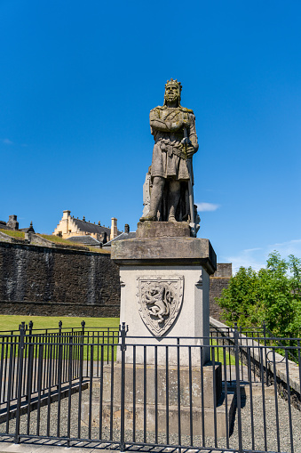 Stirling, United Kingdom - 20 June, 2022: statue of Robert Bruce King of Scotland outside of Stirling Castle