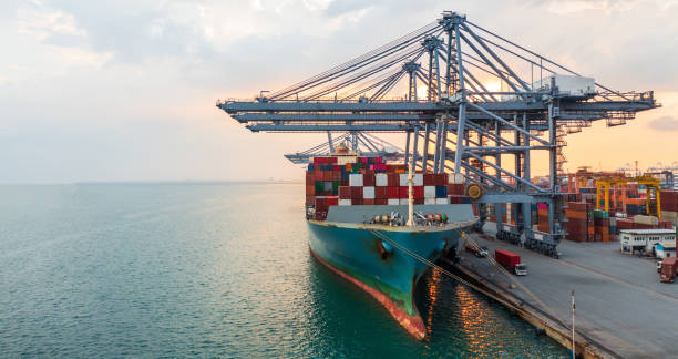 istock Aerial view container ship working at seaport, Global business company import export logistic and transportation of international global trading by container cargo freight shipping cargo vessel. 1406356268