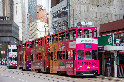 Hong Kong - June 29, 2022 : Double-decker trams at Central in Hong Kong. Hong Kong has the world's largest operating fleet of double-decker trams.