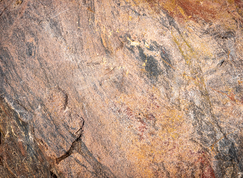 Stone background. Brown solid rocky surface. Natural texture. High quality photo