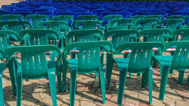 istock Vacant empty plastic chairs pattern. A lot of chairs for spectators. Comfortable furniture for events. 1406362781