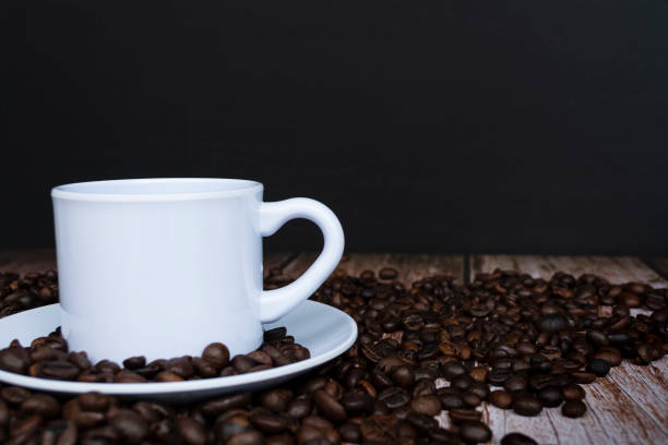 istock Cup of coffee on coffee beans background. 1406365482