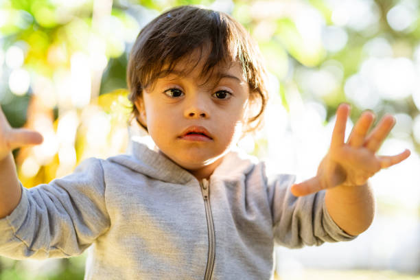 istock Portrait of a boy with special needs in the park 1406367253