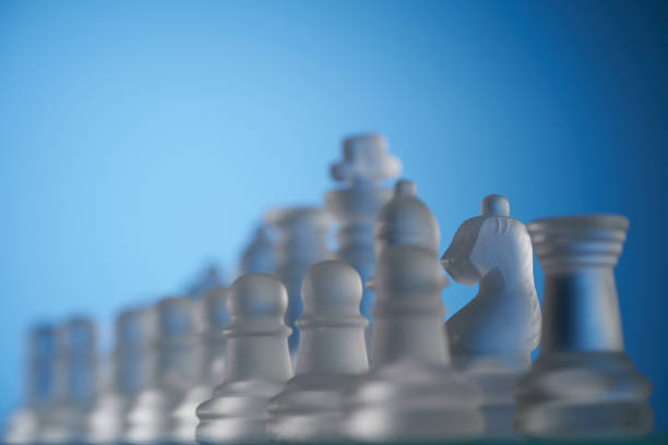 istock group of glass material chess pieces on chessboard 1406370636