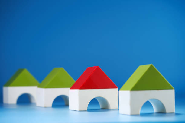 toy house in a row against blue background