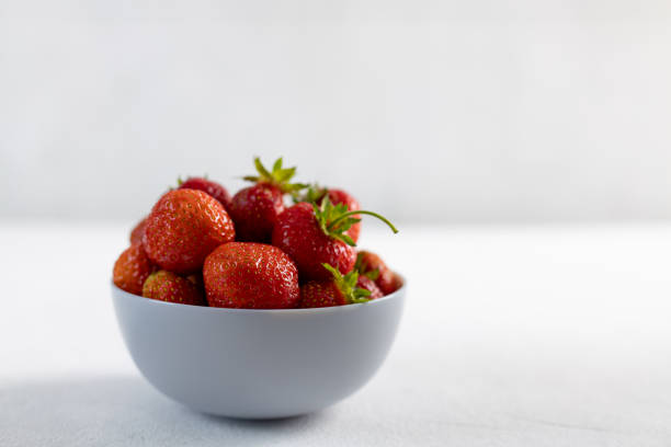 istock Ripe strawberries on light background, closeup 1406370953