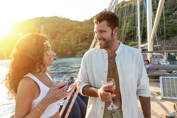 istock A couple is drinking wine and chatting on a luxury yacht. 1406381171