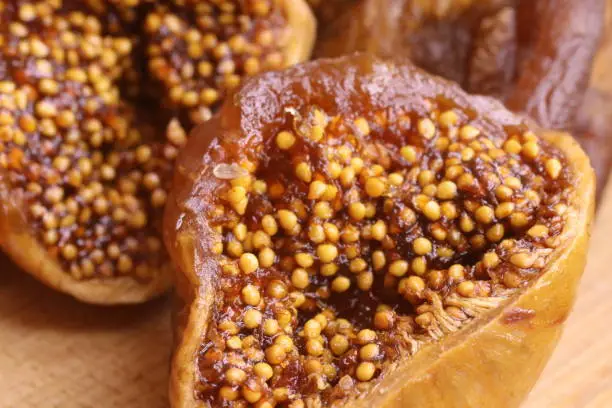 Close-up dried figs on wooden background