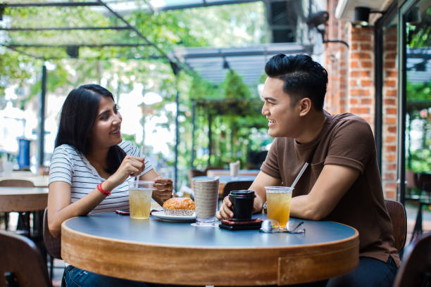 istock Young couple at a coffee shop 1406383519