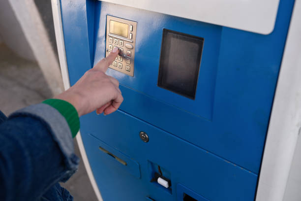 istock Woman hand typing pin code on ATM keyboard closeup 1406386099