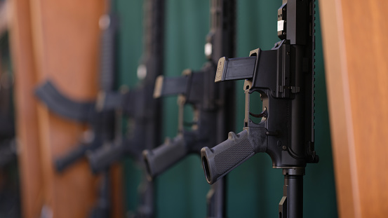 Close-up of collection of rifles and carbines in storage. War, army, police and weapon concept