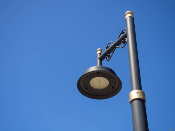 istock Black lantern against the blue sky. Interesting lamp design. Street lighting. 1406391911