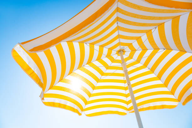 istock Beach umbrella against blue morning sky 1406396811