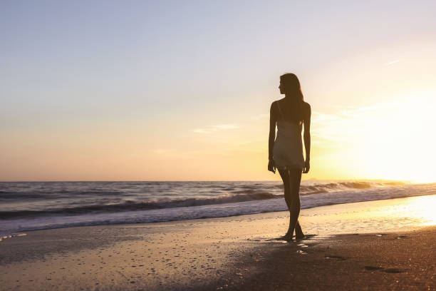 istock Young woman on the beach 1406398989