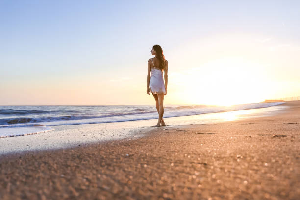 istock Young woman on the beach 1406399003