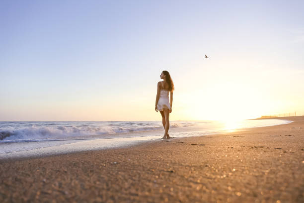 istock Young woman on the beach 1406399010