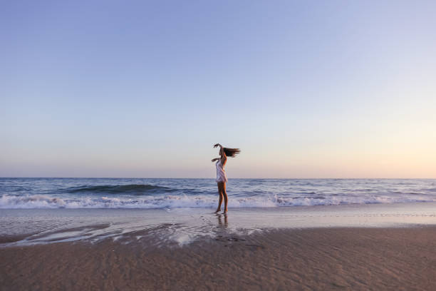 istock Young woman on the beach 1406399027